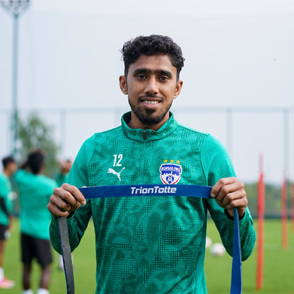 Bengaluru FC Players holding a TrionTotte Power Band